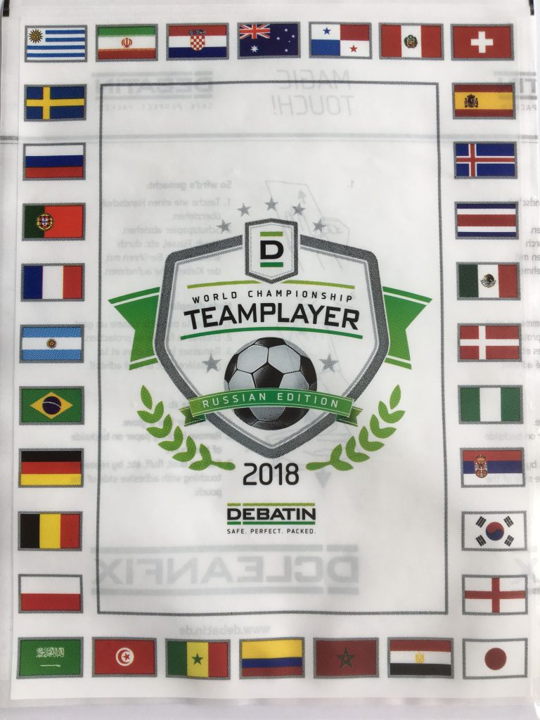 Cleanfix Flat-laid CLEANFIX® bag in the 2018 Teamplayer World Cup edition with surrounding national flags and football emblem.