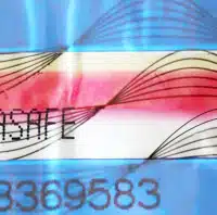 03_DebaTAPE_HighPlus_web_blau Macro shot of a DEBATAPE high plus security tape. The sealing strip displays the inscription “DEBASAFE” and a pattern of fine lines. It has a cold-resistant layer that reveals attempts to tamper by cooling.