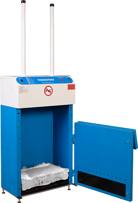 An open thermal baler with a view of a compact bale made of melted and compressed plastic bags inside the machine, demonstrating how the baler significantly reduces the volume of the waste.