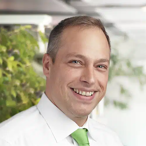 Portrait of Anton Panzner, a friendly-looking man with short hair. He wears a light shirt and looks directly at the camera. Anton Panzner works at DEBATIN.