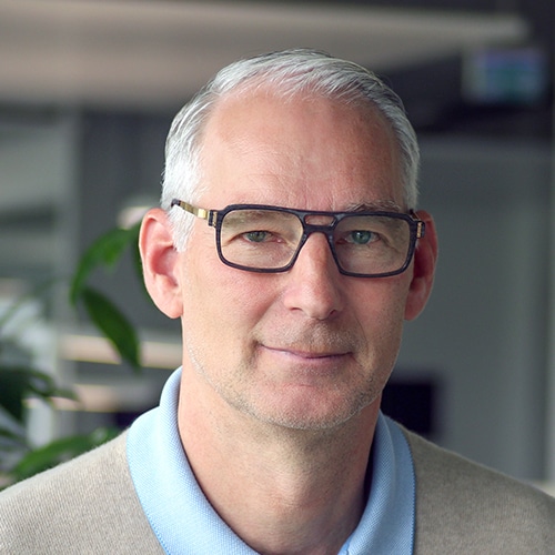 Portrait photo of Frank Rieker, CEO of Anton Debatin GmbH, in front of a blurred office background.