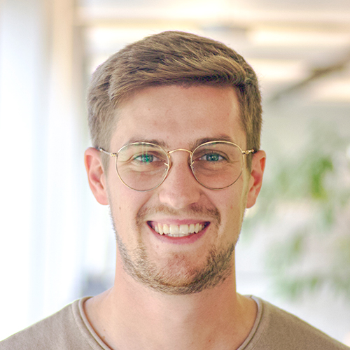 Portrait photo of Luca Rupertus, Technical Purchasing Department at DEBATIN, in front of a bright office background.